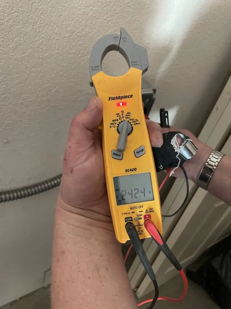 Voltage testing with clamp meter during Electrical Installation Services in South Chicago Heights